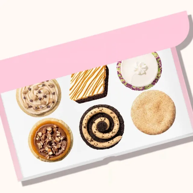 A Crumbl 6‑Pack: six cookies in the pink box